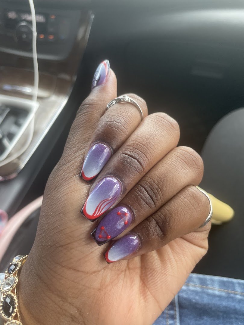 Manicured hands with glossy nail polish.